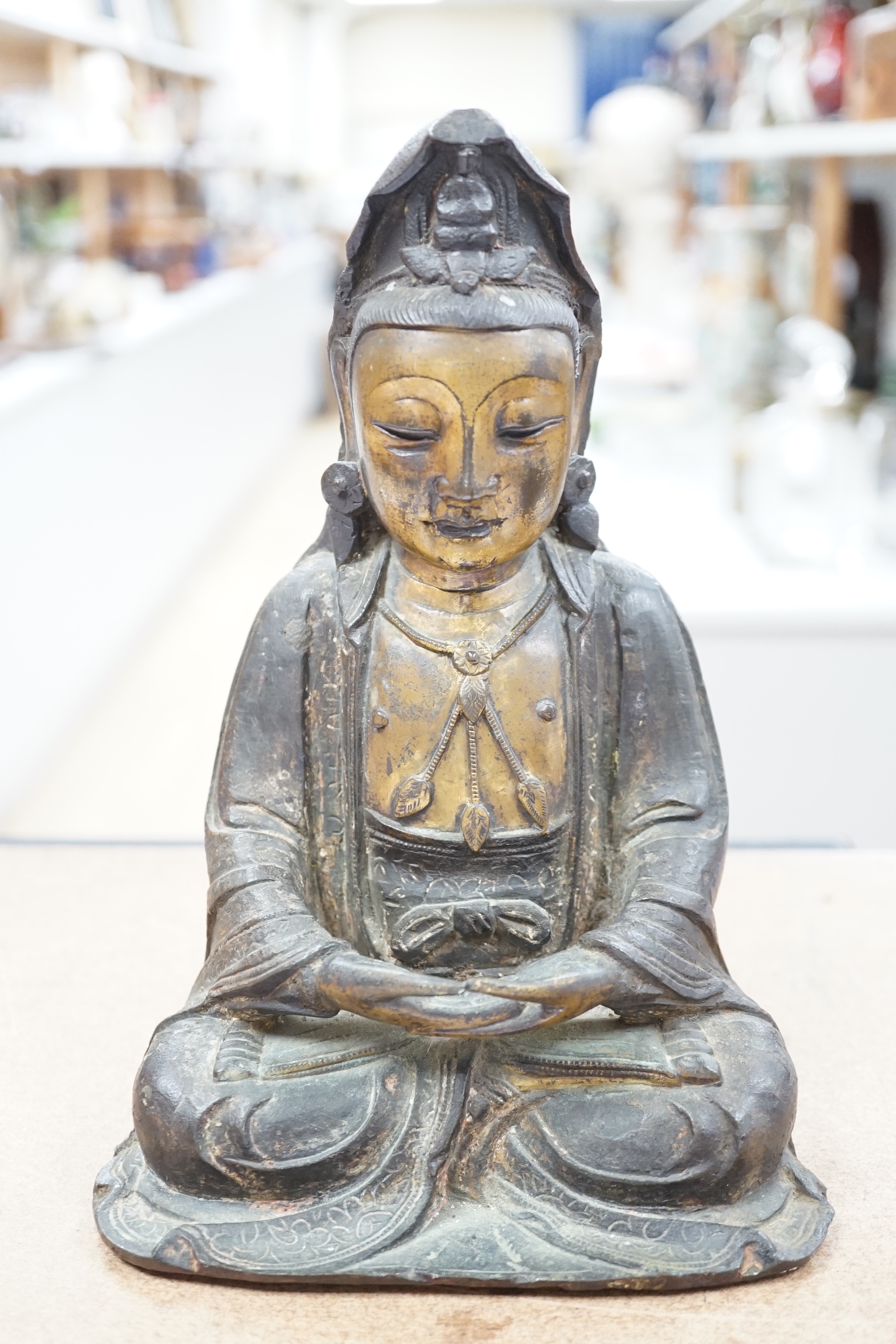 A Chinese Ming gilt bronze figure of Xi Wangmu, Queen Mother of the West, late 16th / early 17th century, Provenance: bought from the 50th Chelsea Antiques Fair, R & D Coombes, 1980, 24cm high